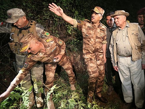 Iraqi Foreign Minister Fuad Hussein inspects the site of a Turkish attack on a mountain resort in Iraq's northern province of Dohuk, Iraq, July 20, 2022.