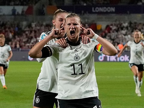 Germany's Alexandra Popp celebrates with Jule Brand, centre left, after scoring her side's second goal.
