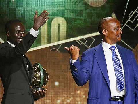 Senegalese forward Sadio Mane (left) receives with the Men's Player of the Year from CAF President Patrice Motsepe during the 2022 Confederation of African Football (CAF) Awards in the Moroccan capital Rabat on Thursday.
