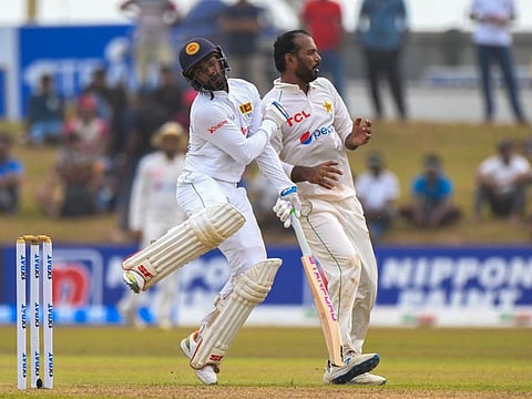 Sri Lanka's Dhananjaya de Silva (left) collides with Pakistan's Nauman Ali during the first day of the second cricket Test at the Galle International Cricket Stadium in Galle.