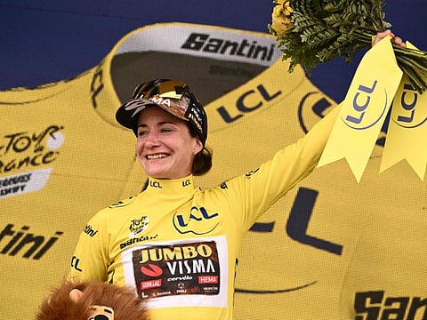 Team Jumbo Visma's Dutch rider Marianne Vos celebrates her overall leader yellow jersey on the podium at the end of the 2nd stage of the new edition of the Women's Tour de France cycling race, 136,4 km between Meaux and Provins.