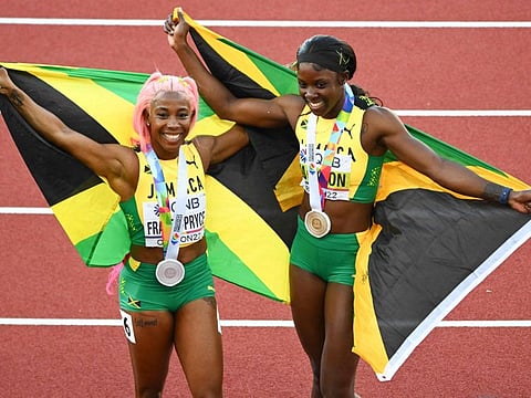 Jamaica's Shelly-Ann Fraser-Pryce (left) and Shericka Jackson celebrate their top two positions in the women's 200-metre in the World Championships in Eugene, Oregon last week.