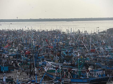 In this file photo taken on September 29, 2021 fishing boats are anchored at the Karachi fish harbour after the Pakistani authorities issued an advisory to discourage fishermen venturing into the Arabian sea expecting bad weather conditions due to the cyclonic storm Gulab.