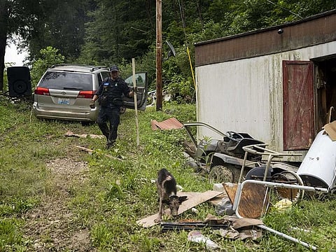 Lexington Fire Department Search and Rescue team perform a targeted search on Highway 476 where three people are still unaccounted for on July 31, 2022 near Jackson, Kentucky.