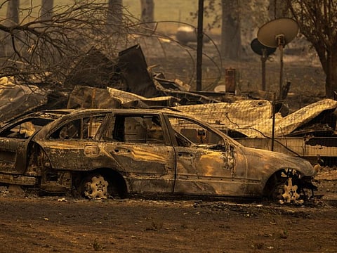 The ruins of the Oak Mobile Park are seen at the McKinney Fire in the Klamath National Forest northwest of Yreka, California, on July 31, 2022.