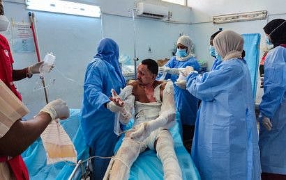Medics treat a man injured in a fuel truck explosion at a hospital in Libya's southern city of Sebha, on August 1, 2022.