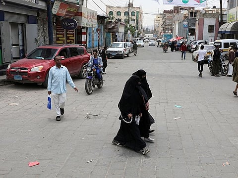 People walk on a street in Sanaa, Yemen August 1, 2022.
