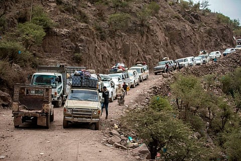 Traffic snarls on a heavily damaged narrow road that serves as a lifeline between Taez, besieged by Al Houthi rebels, and the southern port of Aden on July 8, 2022. Yemen's warring parties agreed to extend a four-month truce hours before it was due to expire, the UN envoy announced on August 2, vowing to "intensify" efforts to secure lasting peace.