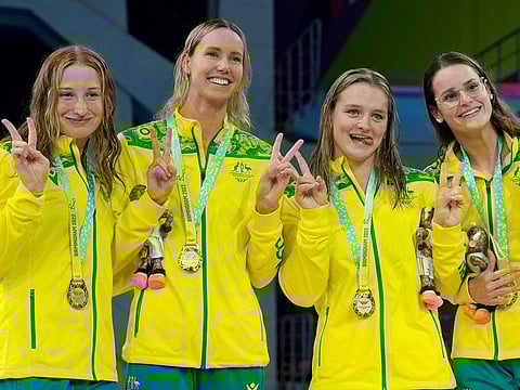 From left: Chelsea Hodges, Emma McKeon, Mollie O'Callaghan and Kaylee McKeown of Team Australia pose after winning the gold in the women's 4x100 meters medley relay final.