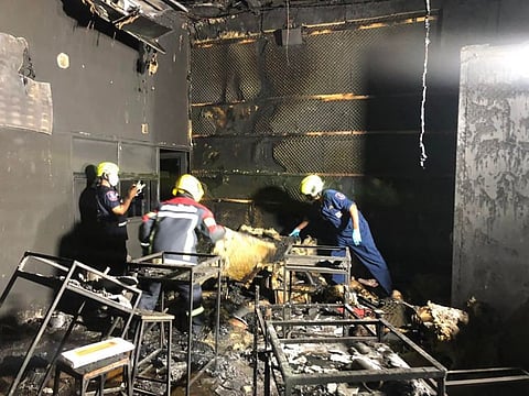 This handout photo taken and released on August 5, 2022 by the Sawang Rojanathammasathan Rescue Foundation shows rescue workers inside the Mountain B nightclub after a fire in Sattahip district in Thailand's Chonburi province.