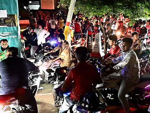 Bangladeshis queue at a gas station in Dhaka after government has increased fuel prices on August 5, 2022.