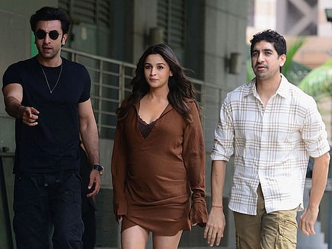 Bollywood actors Ranbir Kapoor, Alia Bhatt and director Ayan Mukerji (right) gesture during the promotion of their upcoming Hindi film ‘Brahmastra: Part One – Shiva’ in Mumbai on August 6, 2022.