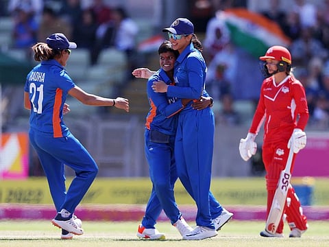 India's Deepti Sharma and Smriti Mandhana celebrates the dismissal of England's skipper Natalie Sciver during the 1st Semi-Final match of the Commonwealth Games 2022, at Edgbaston, in Birmingham.