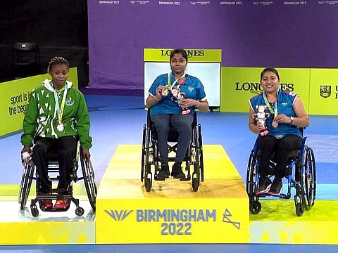 Para-Athletes Bhavina Patel (centre) and Sonalben Patel (right) at the podium pose with their Gold and Bronze medal respectively which they won at the women's singles para table tennis event, at the Commonwealth Games (CWG) 2022, in Birmingham.
