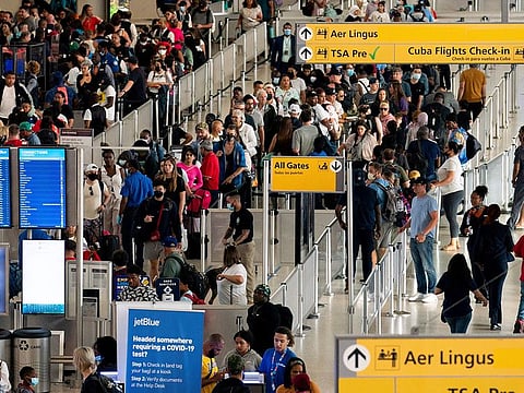 People wait in a TSA line at the John F. Kennedy International Airport in New York.