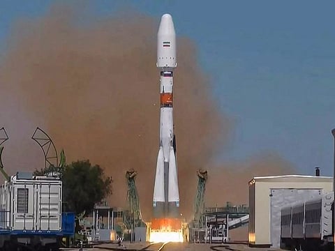 Soyuz-2.1b rocket carrying the Khayyam satellite blasting off from a launchpad at the Baikonur Cosmodrome.