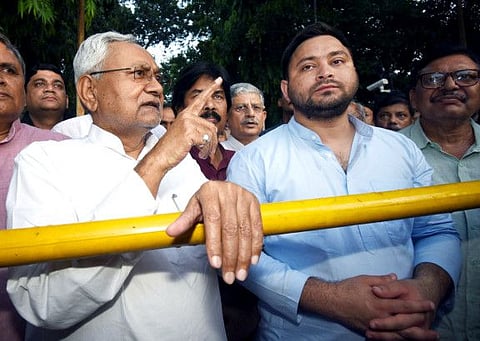 Janata Dal (United) (JD-U) leader Nitish Kumar speaks to the media after meeting Bihar Governor Phagu Chauhan, as Rashtriya Janata Dal (RJD) leader Tejashwi Yadav looks on, in Patna on Tuesday.