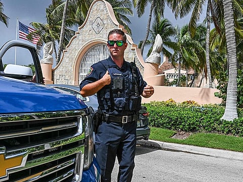 Local law enforcement officers are seen in front of the home of former President Donald Trump at Mar-A-Lago in Palm Beach, Florida on August 9, 2022.