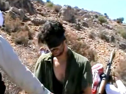 In this image taken from undated video posted to YouTube, American freelance journalist Austin Tice, who had been reporting for American news organizations in Syria until his disappearance in August 2012, prays in Arabic and English while blindfolded in the presence of gunmen.