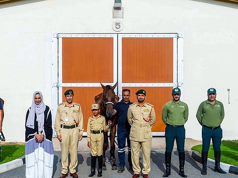 One of the three safety ambassadors with the horse that was gifted to him by Dubai Police