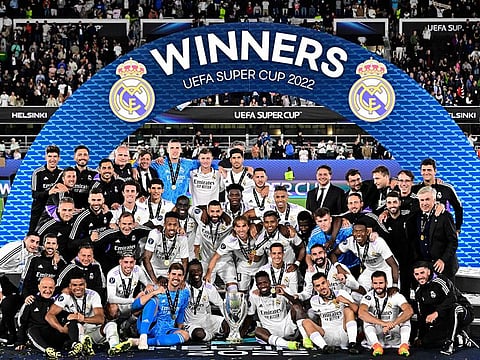 Real Madrid players celebrate with the trophy after the UEFA Super Cup football match between Real Madrid vs Eintracht Frankfurt in Helsinki, on August 10, 2022.