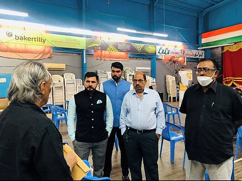 Indian consulate officials interact with community members during the special passport seva camp held in Fujairah.