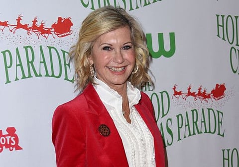 In this file photo taken on November 27, 2016, Olivia Newton John attends the 85th annual Hollywood Christmas parade on Hollywood Boulevard.