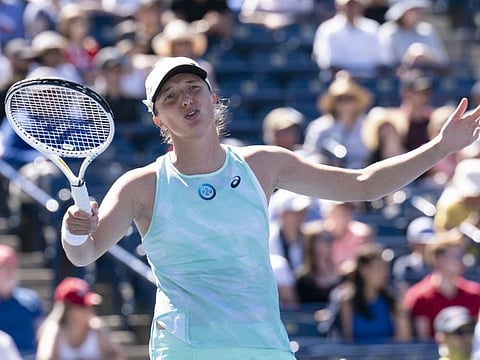 Iga Swiatek reacts during her defeat to Beatriz Haddad Maia in National Bank Open tennis action in Toronto.