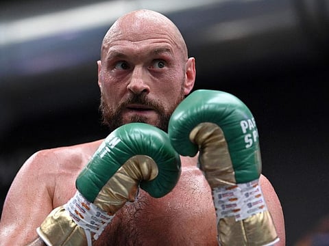 World Boxing Council (WBC) heavyweight title holder Britain's Tyson Fury takes part in an open work-out session in Wembley.