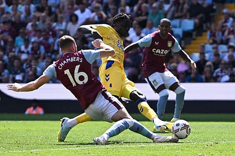 Everton's Amadou Onana (centre) in action with Aston Villa's Calum Chambers (left) at Villa Park during the English Premier League clash.