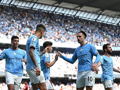 Manchester City's players celebrate their fourth goal against Bournemouth during the English Premier League match at the Etihad Stadium in Manchester, north west England.