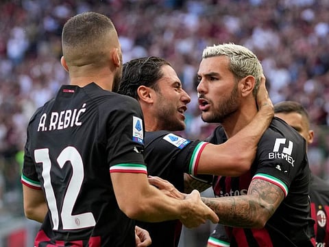 AC Milan's Theo Hernandez (right) celebrates after scoring his side's opening goal during the Serie A match against Udinese at the San Siro stadium, in Milan, Italy.