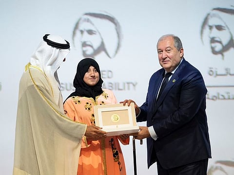 Ilham Qouissem, one of the students at Al Amal Junior High School of Morocco, receiving the Zayed Sustainability Prize.