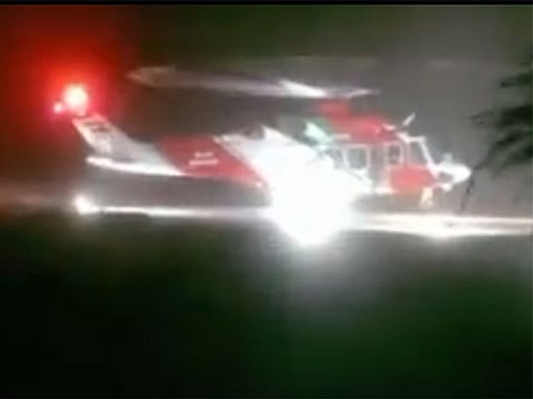 Despite unstable weather conditions, Abu Dhabi Police airlift an ailing man out of Makasib Island. Screen grab from the rescue video