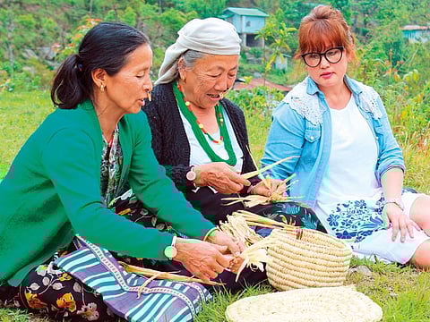 Chimib Ongmu Bhutia (right) with local artisans in Sikkim
