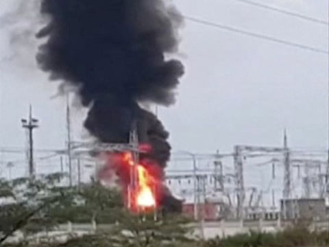 A view shows smoke rising above a transformer electric substation, which caught fire after a blast in the Dzhankoi district, Crimea, in this still image from video obtained by Reuters August 16, 2022.