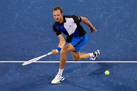 Daniil Medvedev, of Russia, returns to Botic van de Zandschulp, of the Netherlands, during the Western & Southern Open tennis tournament in Mason, Ohio.