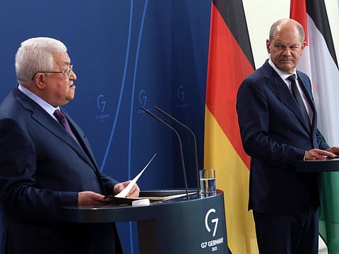 Palestinian President Mahmoud Abbas, left, speaks during a news conference after a meeting with German Chancellor Olaf Scholz, at the Chancellery in Berlin, on August 16, 2022.