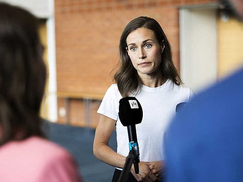 Finland's Prime Minister Sanna Marin speaks with members of the media in Kuopio, Finland August 18, 2022.
