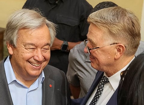 United Nations Secretary-General Antonio Guterres speaks with Rector Volodymyr Melnyk during a visit to the Ivan Franko National University of Lviv, as Russia's attack on Ukraine continues, in Lviv, Ukraine August 18, 2022.