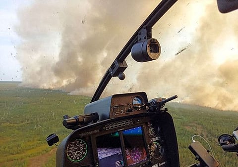 This handout picture released by Greenpeace Russia on August 18, 2022, shows a wildfire from a helicopter in Ryazan region outside Moscow.