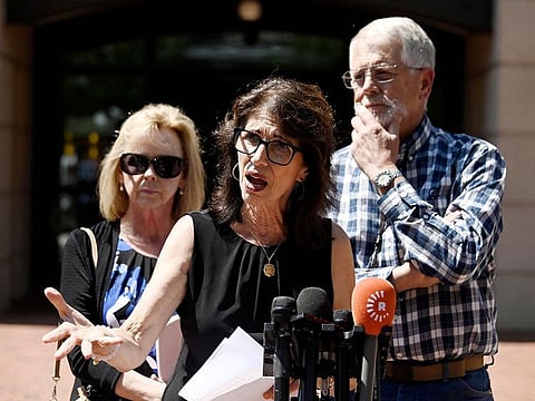 Diane Foley (C), the mother of James Foley, and Carl and Marsha Mueller, the parents of Kayla Mueller, speak to reporters outside the Albert V. Bryan Federal Courthouse following the sentencing of El Shafee Elsheikh, in Alexandria, Virginia.