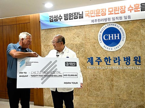 Asian Tour COO, David Rollo hands over a cheque to the Cheju Halla General Hospital in Korea as part of their community engagement programme.