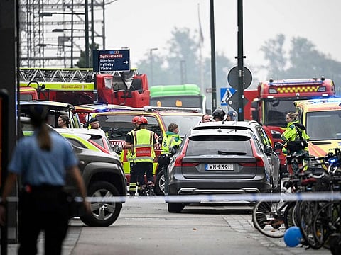 Police secure the area after a shooting at Emporia Shopping Center in Malmo, Sweden, on August 19, 2022.
