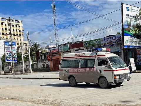 An ambulance drives along a deserted street near the scene of an Al Qaida-linked al Shabaab group militant attack at Hotel Hayat in Mogadishu, Somalia, August 20, 2022.