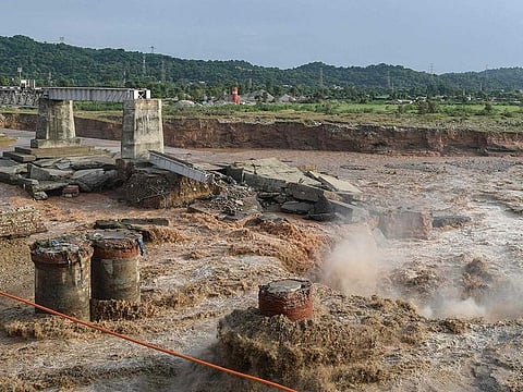 A general view of the section of a railway bridge washed away by the deluge at the Chakki River after flash floods in Kangra district, in India’s Himachal Pradesh state on August 20, 2022.