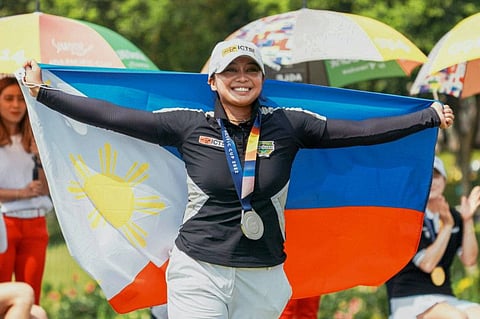 The Philippines' Princess Mary Superal celebrating after winning the inaugural Simone Asia Pacific Cup golf event at Pondok Indah Golf Course in Jakarta.