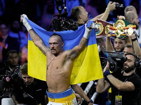 Ukraine's Oleksandr Usyk celebrates after beating Britain's Anthony Joshua to retain his world heavyweight title at King Abdullah Sports City in Jeddah, Saudi Arabia, on Saturday.