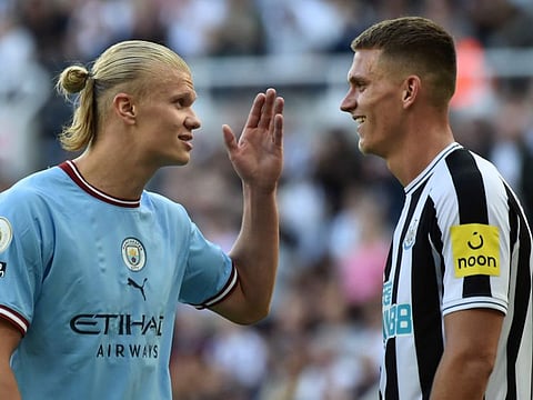 Manchester City's Erling Haaland (left) talks to Newcastle's Sven Botman after their six-goal thriller in the English Premier League on Sunday.
