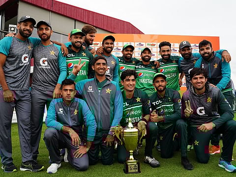 Pakistan players celebrate with the trophy after defeating Netherlands 3-0 to clinch the One Day International series.